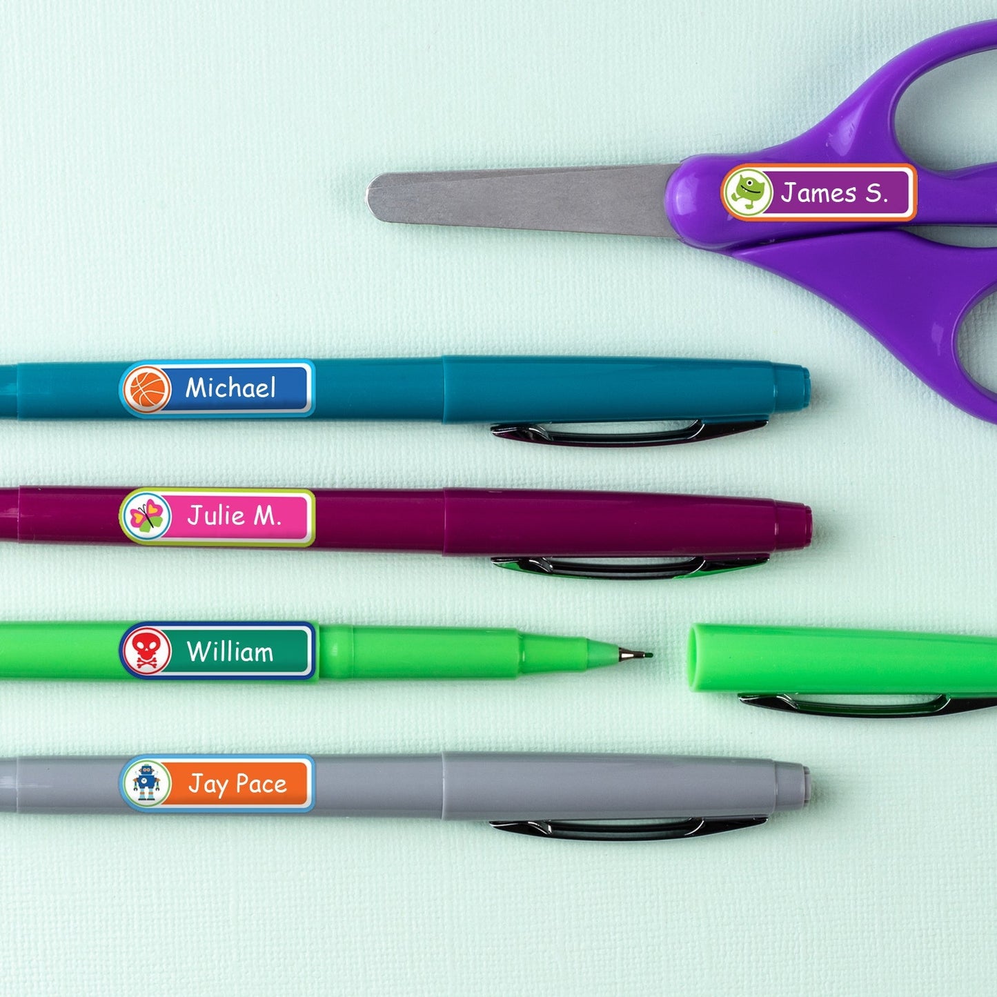 Mini rectangle name labels applied to pens and scissor