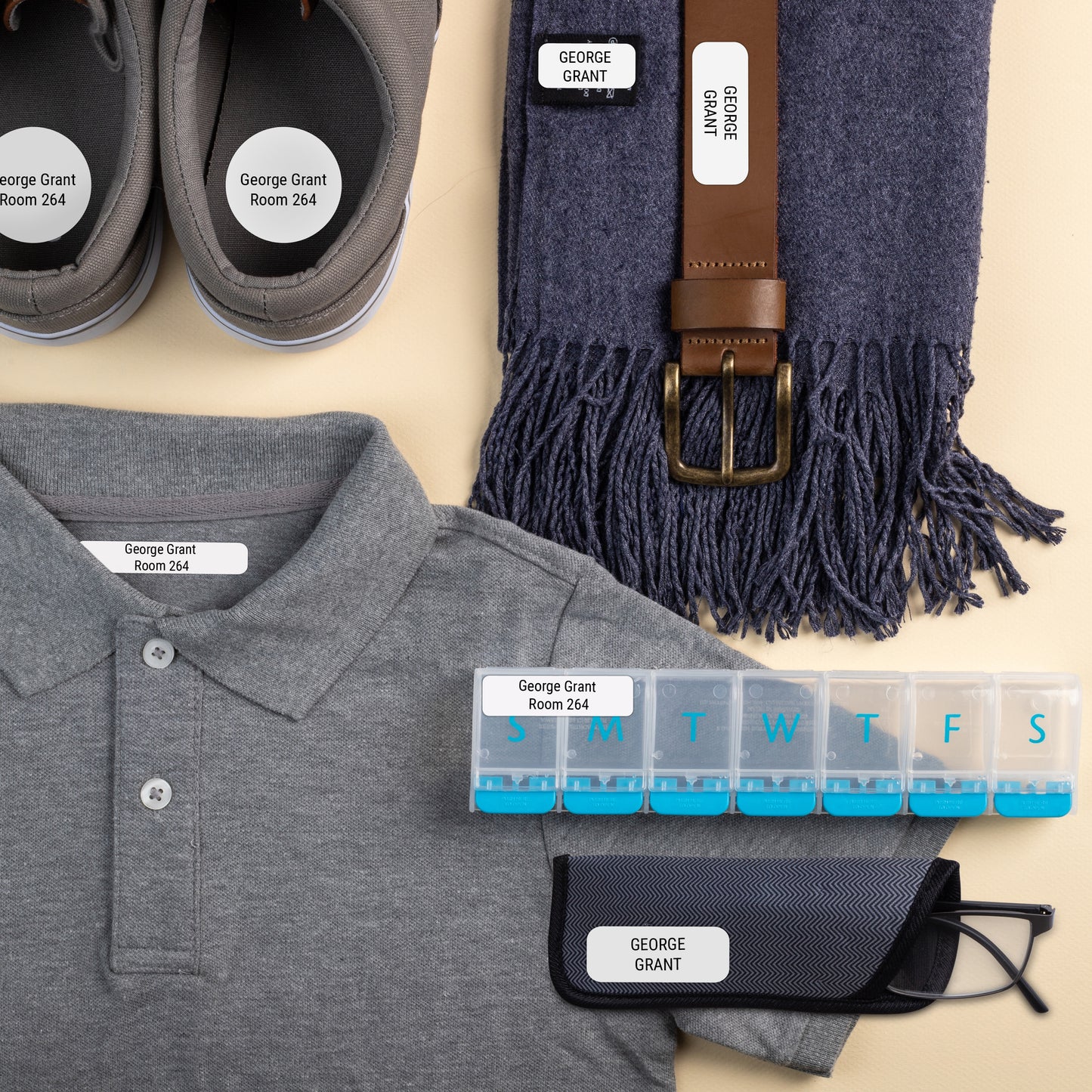 Various sized name labels for seniors applied to clothes, shoes, glasses case, scarf, belt, and medicine divider prepared for nursing some