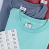 Personalized Stick N' Wear clothing name labels applied to the care tag of t-shirts