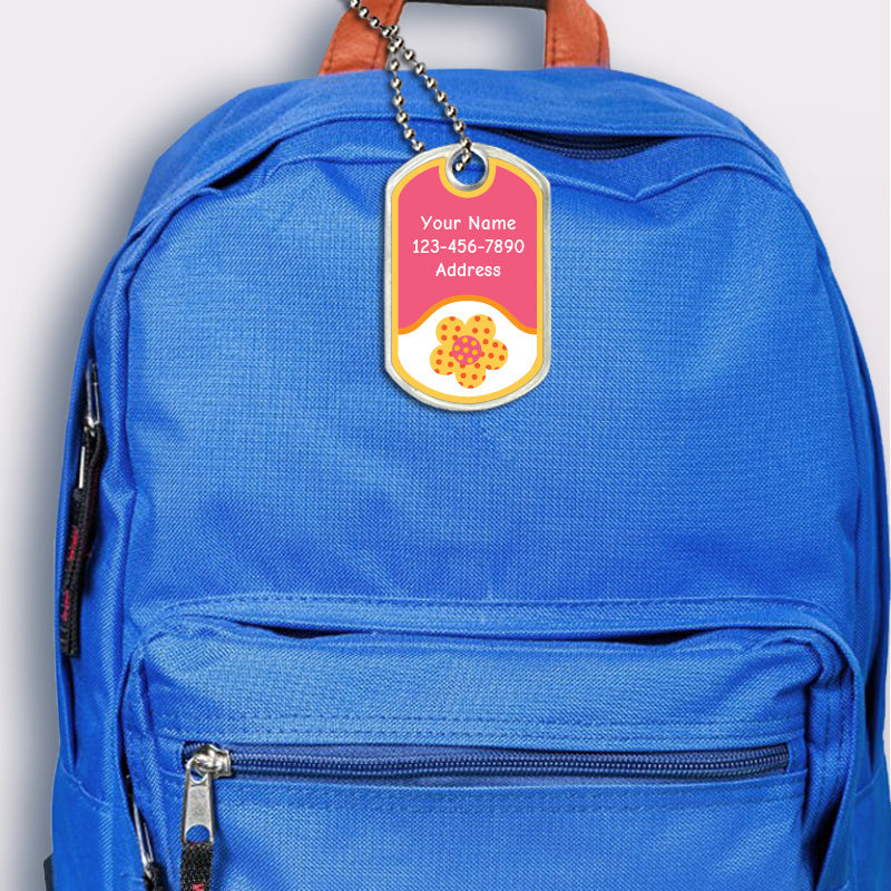 Flower design bag tag attached to backpack 