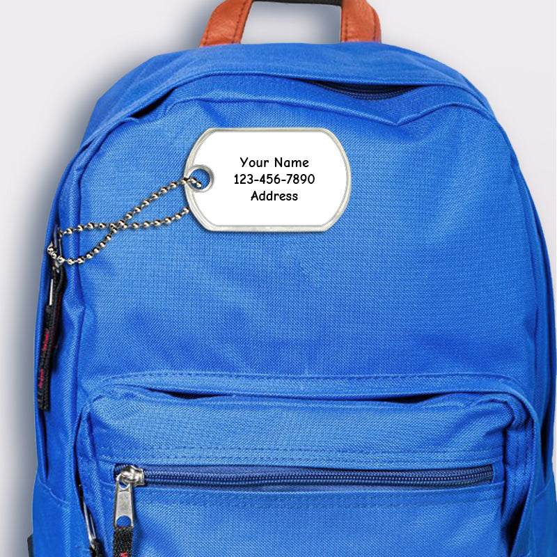 White design bag tag attached to backpack 