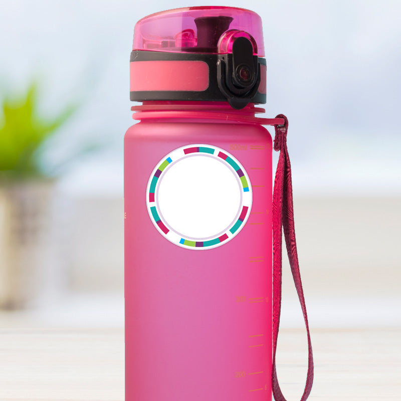 Pink stripes design medium round stick on name label applied to a reusable water bottle